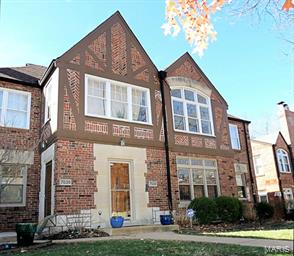 Lovely Tudor style condominium in a two unit building offering the space & privacy of a single family home, & the convenience of a condo. A small foyer leads to the spacious living room with a glorious fireplace at one end & three leaded glass windows at the other. The fireplace wall separates the living room from the dining room which is large enough for a fine dinner party. Flanking the living room/dining room are 2 bedrooms with a bath in between on one side, & 2 more bedrooms & bath on the other side. Serving the dining room is a beautifully updated kitchen & breakfast room. The kitchen with its white custom cabinets, marble counters, tile back splash & fine appliances adjoins the breakfast room - a great spot for your morning coffee. With warm hardwood floors & stylish architectural details thru out, the condo  is the very definition of comfort. A 2 car, tandem garage is in the basement along with a storage locker & a utility room with washer, dryer & an additional refrigerator. Location: Ground Level