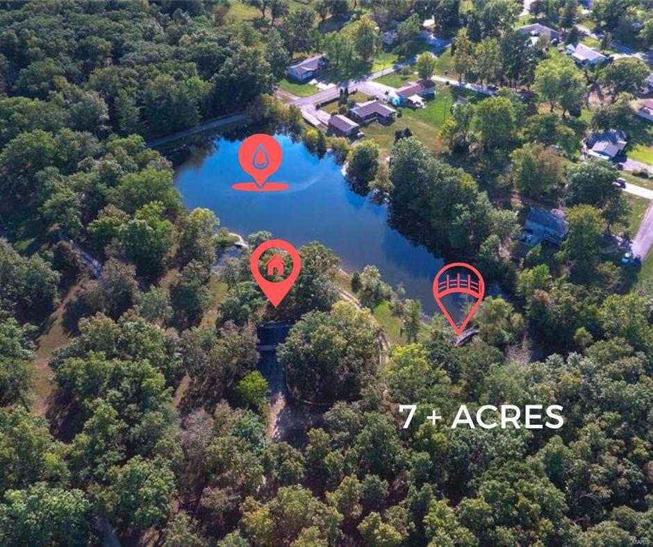 This 7+ acre property sits in the heart of Wentzville/St. Charles County. Close to restaurants, shopping, and highway access. You will see your personal apx 2-acre stocked lake through the private gate and down the drive.  If you are looking for the feel of not being in a populated area, this home is just what you need—a secluded park-like setting. Entering you are met with an expansive pass-through fireplace and entry foyer/living room.  Kitchen appliances have been updated and a garden window lends character to the space. The lower level has abundant potential if you finish it off, add a bath and bedrooms. This spacious property has so much to offer, including an outbuilding with an electric and wood-burning heater, a rear entry 2-car garage, a vintage bar in the basement & character galore!  Picture yourself fishing, paddle boating or just kicking back to admire the property with a cold beverage. Take in the view or entertain friends...so many possibilities here!  Check it out! SpecialListingConditions: Probate