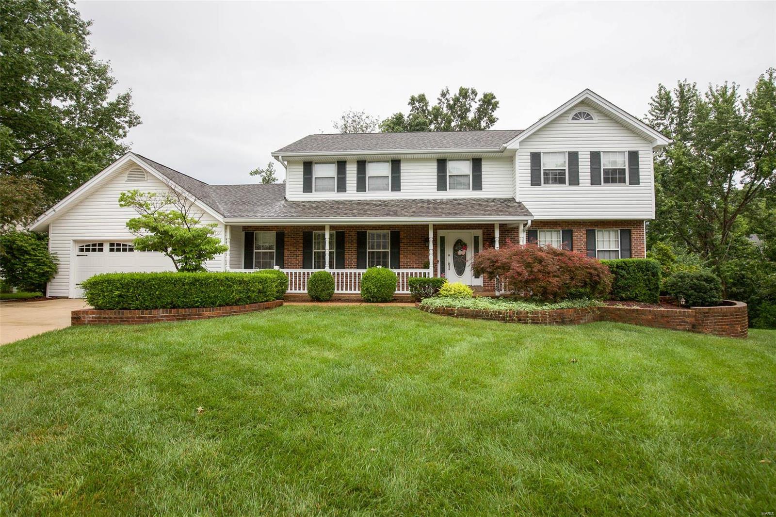 Spacious 4 bed 3.5 bath home with over 2700 sq ft of living space. Large covered front porch and 2 car garage. Hardwood floors on main floor. Formal dining room and living room in the front of the home. Family room features built in shelves surrounding the fireplace. Bay windows and ceiling fan in the family room. Wet bar between the kitchen and family room makes entertaining easy. Large eat-in kitchen boasts tile floors, granite counters, center island with gas range, 36in custom cabinets and pantry. Soak up the sun in the sunroom off the kitchen with 2 ceiling fans and access to the deck. Half bath and laundry on the main floor. Upstairs, the master site offers a generous amount of space. Coffered ceiling, fireplace and large closet in the master. Double sinks, tile flooring, soaker tub and separate shower in the master bath. 3 guest bedrooms and full guest bath upstairs. Finished walk out lower level with office space and wet bar. Mature trees in the fenced in backyard. Additional Rooms: Sun Room