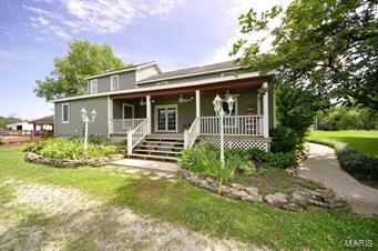This lovely picturesque home is conveniently located just minutes from I-70.  Enjoy the privacy of this very tranquil and peaceful homestead. 4 large bedrooms, 3 baths, country kitchen with breakfast area, formal dining room, hardwood floors, wooden staircase and wood-burning stove for those long winter nights are only a few of the many features that will captivate you. In addition , the 24,000 gallon, above-ground pool is surrounded by professionally installed wooden decking with rod iron spindles, built-in seating and TiKi Bar area for hours of fun & relaxing throughout those summer months.  Fenced in garden area with established grapevines, country setting and wildlife will make this your home for all seasons!  (BEAUTIFUL NEW PICTURES)  **Continue to Show **