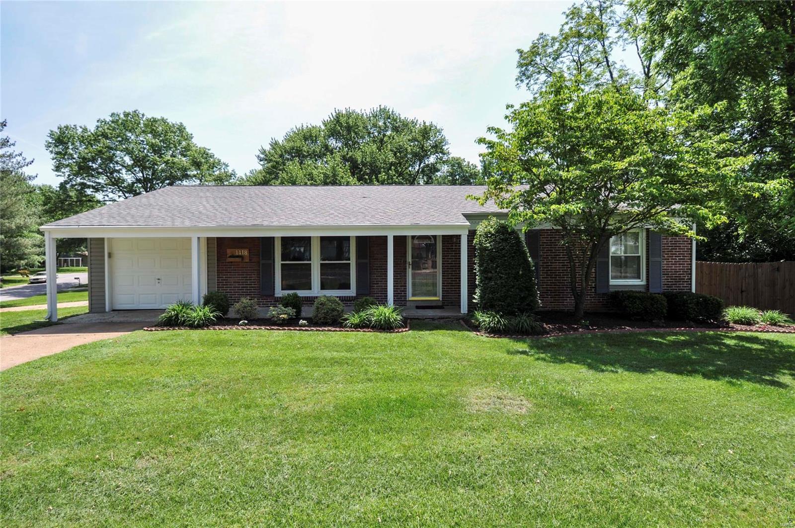 Est. 1953, fall in love with main floor living at this super cute, updated ranch. Special attention goes to the custom built-in bookcases on each level, hardwood flooring and generous closets throughout. There is plenty of space for entertaining in the living room, open concept dining area and finished lower level.  The Sellers have hosted a holiday gathering for 25+ guests on an annual basis. Spacious, eat-in kitchen will include all appliances. Three bedrooms on the main level include the master with attached bath. In the lower level one can sprawl out between the recreation and bar areas. Also find another (4th) bedroom, full bath, laundry and storage area.  Plenty of other perks here: big deck with hot tub, attached garage, 6-year old roof and more. Enjoy how extremely walkable this neighborhood is - walk to the elementary and high school, tons of shopping, and the public library. You could also get where to you need to go quickly with access to  I-270, I-64 and the Page Extension.