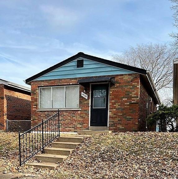 Full brick mid century modern, 2 bedroom home across from park, near school. Beautiful hardwood floors throughout. Living room flows to dining room. New (2021) stove and refrigerator to remain. Full basement is big, open and ready for your plans. The detached garage has been freshly painted and new door installed. 2021 Improvements include: A/C with security cage, new roof, fresh paint inside and out, refreshed kitchen with newer stove and refrigerator, and vintage bathroom. New blinds. Move in ready. Don't wait!
