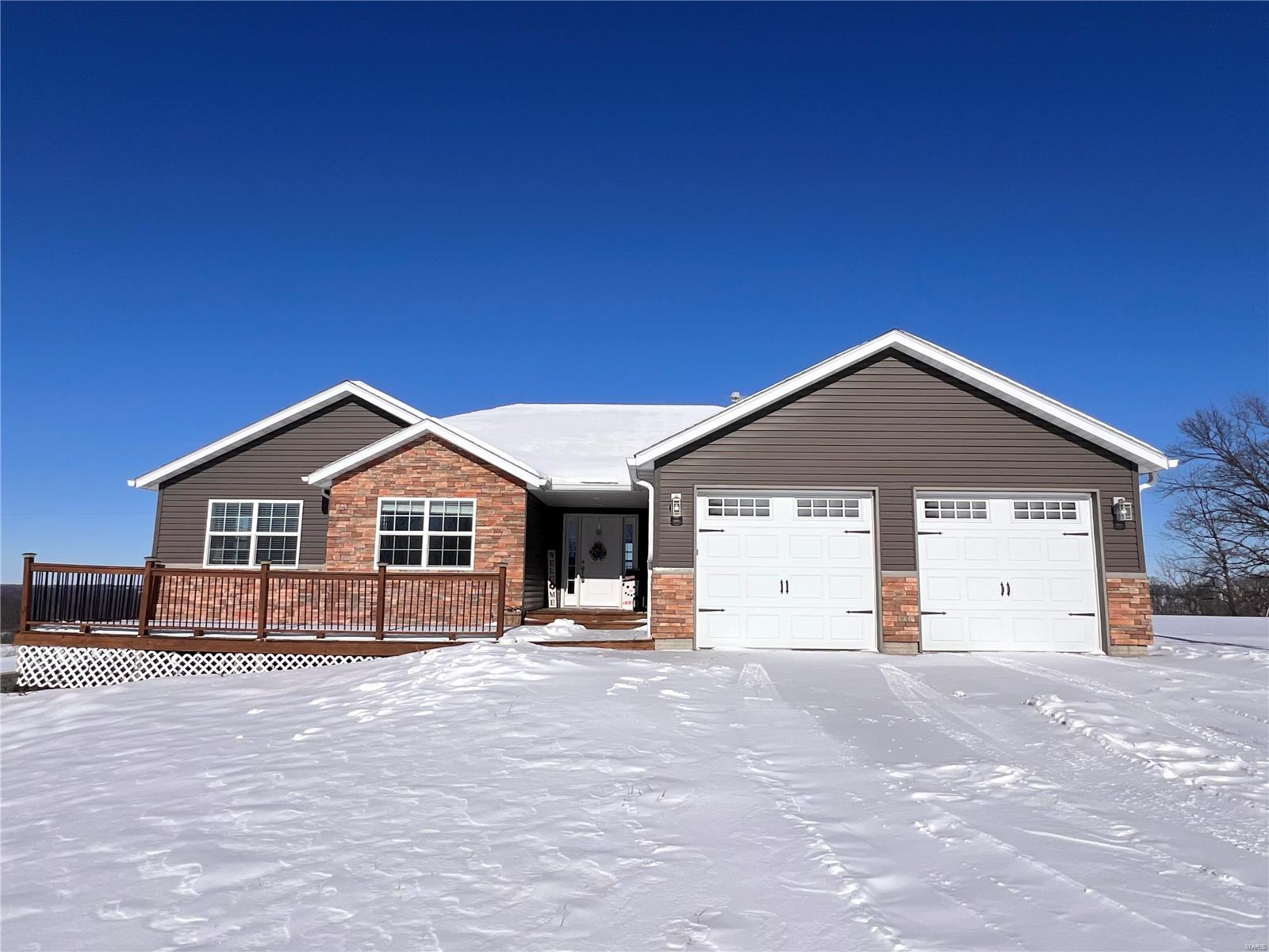 Welcome HOME! 4 Bedroom - 3.5 Baths on 1.38 acres located in Bunn's Lake Estates. Enjoy Picturesque setting on top of the hill from the front or rear deck of this home! This home offers over 3,600+ sq. ft of living space with enough room for the entertainers dream. Main Level offers an open floor plan. Large entry foyer, living room, dining/kitchen combination, main level laundry 3 Bedrooms and 2.5 baths. Kitchen features a center island, walk-in pantry and desk area. The lower level features a finished large 4th Bedroom, a room that has been used as a work out area/storage but could be come another sleeping area. The basement boast a large family/entertaining area with a bar and walks out to to the back fenced in yard. Updates include: fence (2020), finished basement and bath (2021), carpet & plank floor (2023). Radon mitigation system present. $150/year for road maintenance. If you're wanting a well built home with a gorgeous view, don't miss out. Call for your appointment today!