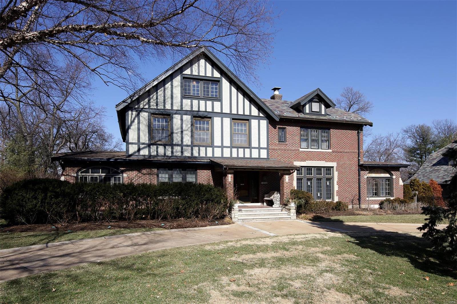 Timeless elegance combined with quality updates, stunning moldings, gorgeous stained and leaded windows, marble and wood floors and arched doorways are just some of the exciting interior features. Two steps down from the large foyer is a light filled living room that has a large fireplace with a beautiful mantle and an intricate iron archway leading to the sunroom. The dining room is party sized with doors that can be opened to the den. Next to it is the office and guest bath. A chef’s eat in kitchen features granite counters, a moveable center island and entrance to the 3-season room which overlooks the fabulous pool and gardens. Three large bedrooms on the second floor have hardwood floors, custom closets and updated baths. The third floor is finished with flexible space for a guest room, playroom or family room. This prime U. City location is walkable to all of Clayton's treasures. A lifestyle perfect for modern and traditional tastes.