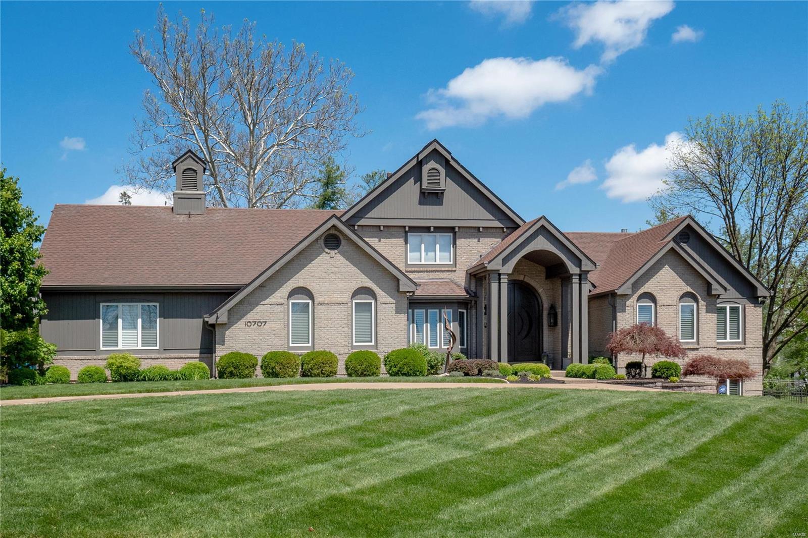Sophisicated organic design w/ a touch of shimmer, this home is one of a kind!  Enter through the 12-ft white oak door & be wowed by the open floor plan & attention to detail.  Ceilings detailed w/ reclaimed wood, handscraped Hickory plank flooring, & plantation shutters throughout.  Custom kitchen w/ panel front Sub-Zero refrigeration, wolf gas range & ovens, double Asko dishwashers & Quartzite countertops.  Laundry/Pool changing room w/ custom cabinetry, porcelain tile & adjacent powder room.  Master suite retreat w/ coffee bar & Sub-Zero refrigeration, gas fireplace, large lounge/sitting area, St. Louis Closet Co. closet & spa like bathroom w/ bookmatched marble walls, zero threshold shower entry & separate soaking tub.  The spacious lower level has a full kitchen, bar area, climate controlled wine cellar, gym and another 3 beds/2 baths, one with a steam shower.  The outdoor oasis has pool, hot tub, covered patio with fireplace, additional seating area and kitchen with Viking grill. Additional Rooms: Mud Room, Wine Cellar