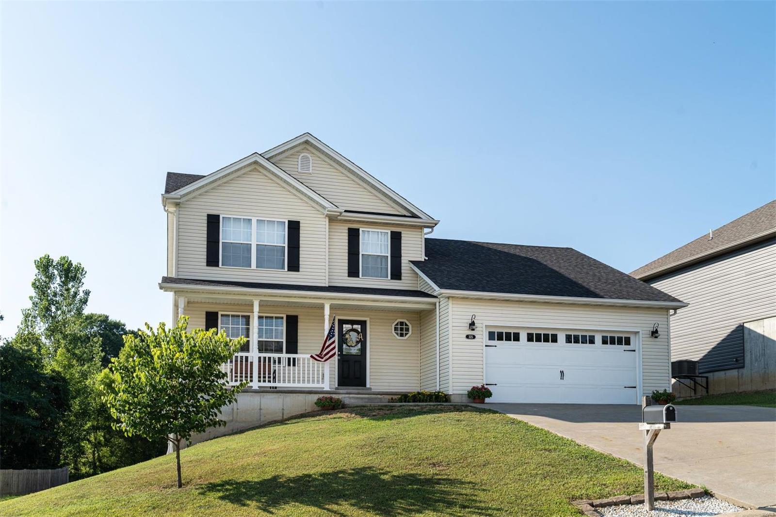 * SUPER GREAT FAMILY HOME backs to common ground for more room to play! * Spacious 4 BR 3.5 bath home you can move right into & start living! Open floor plan design, main floor laundry, some built in shelving for decorating, super nice room sizes, walk in closets, great kitchen with island & breakfast bar, dual system HVAC for great efficiency, nice looking carriage style garage doors with coach lights calls you home at night. Approx 890+ sq ft Lower level finish is another plus with good natural lighting from egress windows and large rec room and family room & full bath for extra living space! Unique private safe room/storm shelter & storage space with shelving. All this plus front porch view & access to subdivision stocked lake! Fishing within walking distance along with paved walking trail & ball field area for all to enjoy -18 acres of common area! Some big bass & crappie have been caught by sellers & family there! * COME ENJOY!! * (Basement finish sq footage is approximate!)