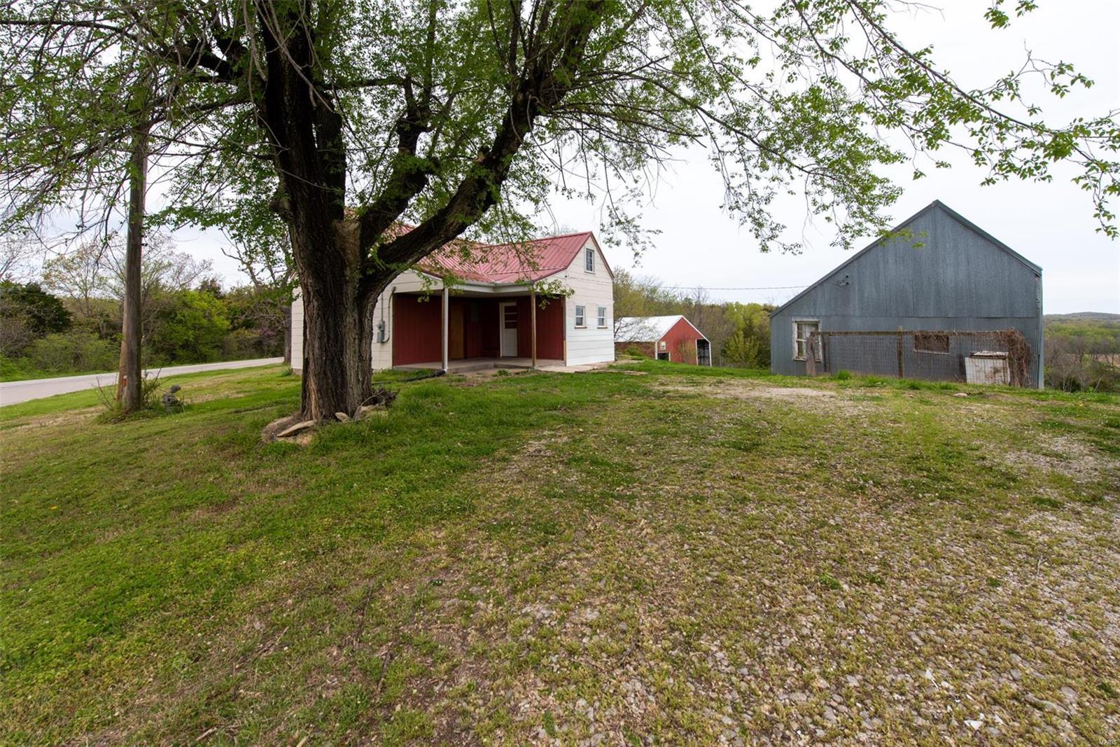 Rustic County House, main house built in late 1800's started as a Log Cabin and now has a new metal roof, Modern Forced air furnace and A/C, remodeled kitchen, new well.  There are 4 rooms on main level and 2 rooms in upper level. Situated on 6/10 of an acre with a beautiful view.  No restrictions, No Subdivision.  Washington Schools.