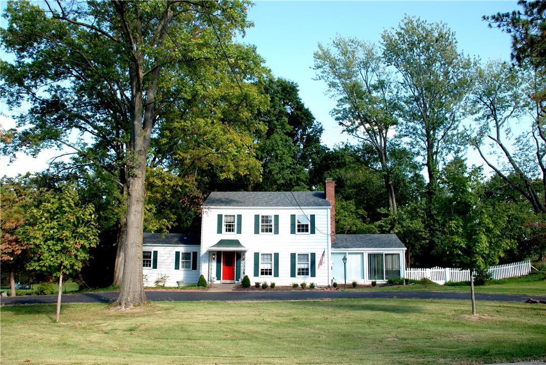 Are you looking for a 2 story on a phenomenal .96 acre lot? Then look no further, this is the house for you. A classic 2 story w/circular drive welcomes you & your guests, providing plenty of parking for all occasions. Enter the foyer w/parquet flrs, to the right your large formal living rm w/fireplace flanked by built-ins on either side & red oak floors beneath the carpeting. The formal dining to the rear offers easy access to the updated kitchen or casual entertaining in the huge, sun-drenched 4 season rm overlooking your parklike backyard. The kitchen affords gorgeous 42” cabinets, stainless appl’s & solid quartz tops. The family rm offers 3 walls of windows, wood flrs & gorgeous views of the yard. Upstairs you’ll find the master w/2 closets, ceiling fan & lots of natural light. 2 add’l bedrms, ea w/wood flrs, 2 windows & ceiling lights. 4th bedrm is currently used as a huge walk-in closet but would make a great nursery or study. Walk-out LL w/rough-in is waiting to be finished.