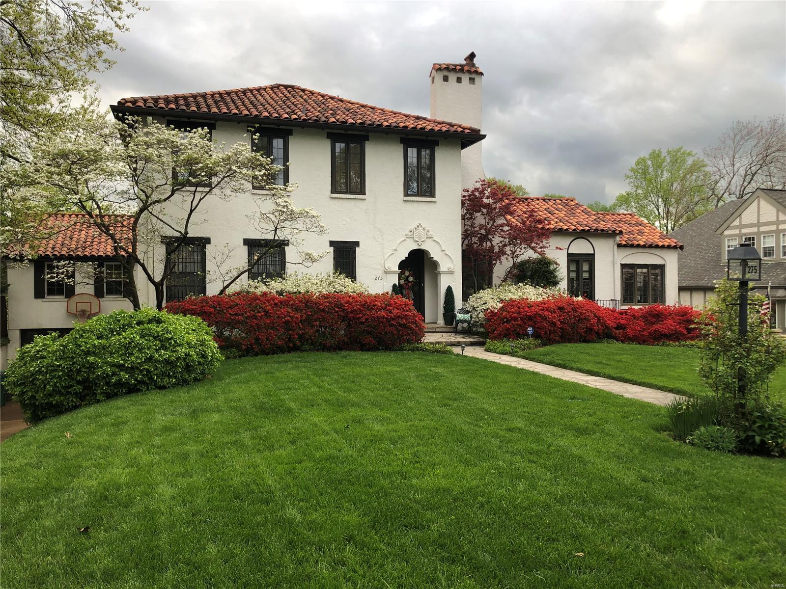 Step into timeless elegance with this stunning Mediterranean-inspired home in the heart of Webster.  Upon entering, notice the architectural details from decorative crown molding, pristine plasterwork, & wrought iron finishes. The main floor has living room with decorative fireplace & charming balcony overlooking the dramatic two-story great room.  An arched entrance leads you to a handsome home office. The luxurious primary suite offers an expansive bathroom & walk in-custom closet by California Closets. The upper floor has three bedrooms & two full bathrooms. The beautifully renovated kitchen designed by Castle Design seamlessly flows into the dining room, great room and breakfast room. The great room opens onto three patios.  The laundry room & recreation room are also on this level. The two garage & coach house round out this amazing home.  Home measured by appraiser. The main level has 2140 sq. ft, the mezzanine has 1421 sq ft. &  upper floor has 851 sq. ft.