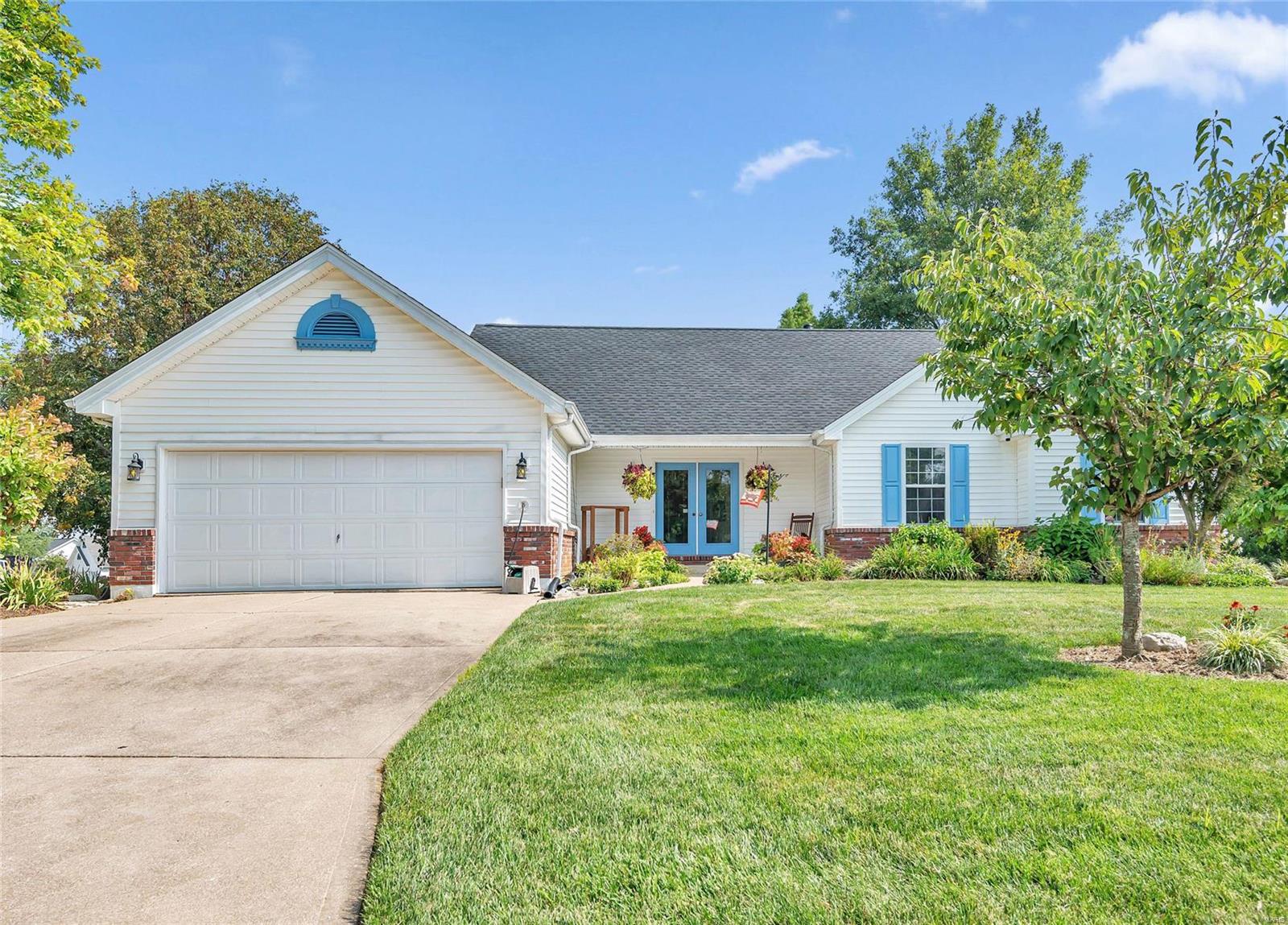 Lovely well keep home.  Beautiful yard with lots of plants. 3 bedrooms on the main level with a very open floor plan.  Vaulted ceiling in the kitchen and great room.   Main floor laundry off the kitchen. Primary bath has been updated with a shower and double sinks.  Very large deck off the kitchen.  Lower level features a large workshop, fireplace and a storage room.  It also has a full bath.  There are 2 exits in the lower level.  New roof installed in August of 2024
