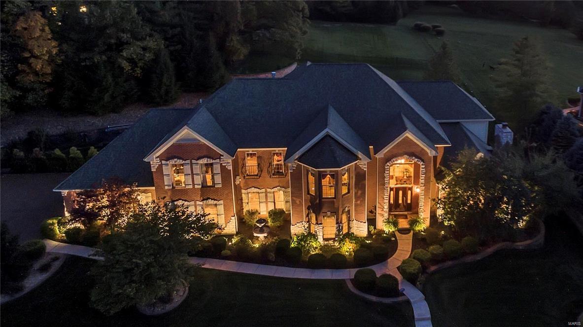 Spectacular brick & stone Manse on Whitmoor Country Club grounds! Over 7000 sq ft of living space enhanced by Brazilian mahogany & Travertine marble flooring, soaring ceilings & elaborate millwork. Impressive 2-sty marble foyer leads to elegant dining room, formal living room with marble fireplace, private study, stunning great room with stone fireplace flanked by 2-sty palladian windows and main floor guest suite. Designer kitchen with granite countertops, 42” cabinetry & professional quality appliances adjoins light-filled breakfast room with granite sideboard and hearth room highlighted by floor-to-ceiling stone fireplace. Front & rear staircases access sumptuous master bedroom suite with walk-in closet, marble bath with Finnleo sauna & sitting room plus 2 generous-sized additional bedroom suites. Lower Level includes game room, recreation room with fireplace & wet bar, office, hobby room & ½ bath. Situated on a 1+ acre lot with pool, hot tub, patio with fire pit & 3-car garage.