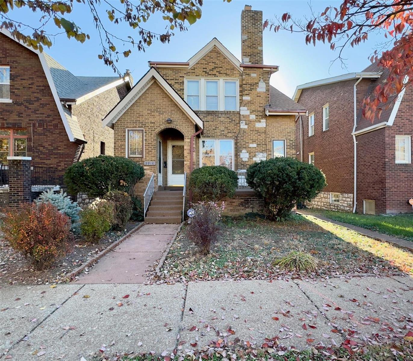 Investment opportunity awaits with this solid two-family home in South City. Each unit features a spacious living room, separate dining room, kitchen, two bedrooms, bath, and sunroom. Beautiful wood floors throughout. The upper unit stands out with a vaulted living room ceiling and open floor plan. Spacious lot with great curb appeal. Explore the large basement, perfect for storage, and enjoy the convenience of a two-car tuck-under garage. A timeless property offering potential for both owner-occupancy and investment.