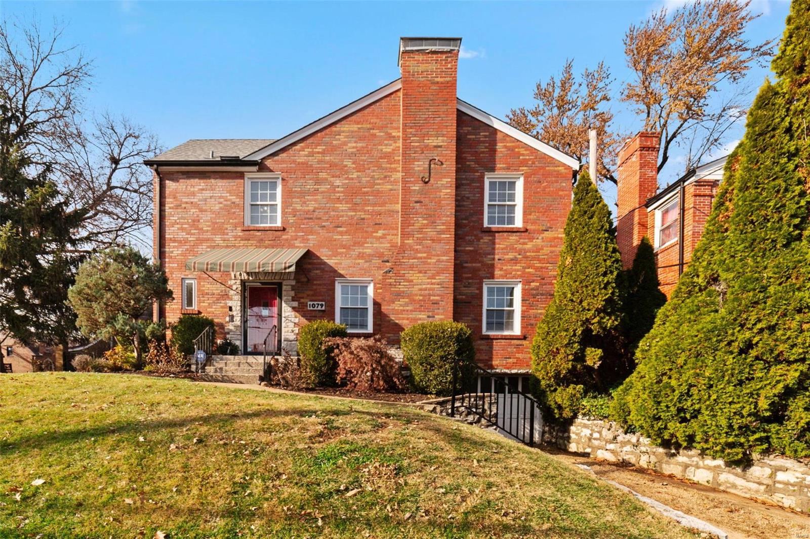Charming historic details are matched with modern updates in this full brick English 2-story, including a recently updated roof, HVAC system & baths! Refinished hardwood floors, arched doorways & soothing natural light from 4 windows in the family room, which flows into the formal dining room & kitchen that includes a greenhouse window perfect for growing fresh herbs. Spacious suite on the main level could be used as a primary bedroom, with an attached full bath & French doors that lead to the private fenced back yard, or could be a second living room. Upstairs are 3 big bedrooms, each w/BRAND NEW carpet, & a beautifully updated bath w/LVP floors. Attached deep garage. Located on a corner lot on a private (not through) street across the street from 85-acre Heman Park, pool & rec center & less than 2 miles from fun shopping, dining, & entertainment venues on the Delmar Loop & in Clayton. Home warranty included for additional peace of mind. Darling home in a great location! See it today!