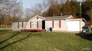 Total of 3 parcel ID's to this property also included is 14-02.0-0-00-002.000.000 and 09-34.0-0-00-009.000.000  Double wide home is on a concrete foundation(3 foot crawl space) New laminate flooring throughout, new bathroom vanities, new furnace and a/c unit,newly painted and well has been recased . Located 30 minutes from Washington, mostly wooded with a creek. Please note the immediate area around the home is located in a flood plan due to the creek. There is an old barn on the property.