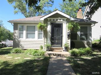 LOOKING FOR THAT CUTE KIRKWOOD CHARMER? Curb appeal is only the beginning. Wood floors throughout the main level. Nice living room with wood burning fireplace and a brick hearth. Formal dining room. The kitchen has updated stainless steel appliances and a gas stove and plenty of room to cook. There are two main floor bedrooms boasting wood floors and a updated full bath servicing both bedrooms. The lower level is unfinished and has a one car tuck under garage. There is a side deck off of the kitchen that leads to a patio in back. Just a great home walking distance to downtown Kirkwood. Newer windows,hvac,newer wood floors,siding,newer 50 gallon water heater and newer 200 amp box. How sweet is all of this!!