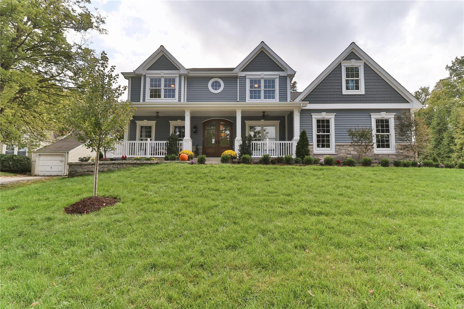 Custom 6 Bedrm 4.5 Bath Home by MRM Manlin Development Group on Gorgeous 1/2 Acre Lot w/ Sweeping Front Porch and 3 Car Side Entry Garage. Walking Distance to Kirkwood Historic District.  Just Under 4000 Sq. Ft.and 1000 Sq. Ft. in Finished Low Lev. Rich Wood Floors, Surround Sound, Crown Molding, Recessed Lighting, 9’ Ceiling on Main Level with 12’ Box Beam Ceiling in the Great Room; Direct Vent Fireplace Flanked w/ Built in Bookcases. Center Isle Kitchen w/ Monogram Series Appliances, Quartz Countertops, Under Cabinet Lighting. Breakfast Room. Screened in Porch. Dining Rm w/ Sculptured Ceiling, Wainscoting. Luxury Master Suite: Coffered Ceiling, Bay Window, Walk-in Closet.  Master Bath: Soaking Tub, Oversized Separate Shower with Marble Surround and Inlay, Double Sinks, Quartz Vanity. Upstairs has an Optional Bedroom or Bonus Retreat.  Main Floor Laundry with Built in Cubbies.  Finished Low Level w/ 10'pour! Handsome Wet Bar, Family Area, Full Bath and Guest Bdrm/ Exercise Rm Additional Rooms: Mud Room