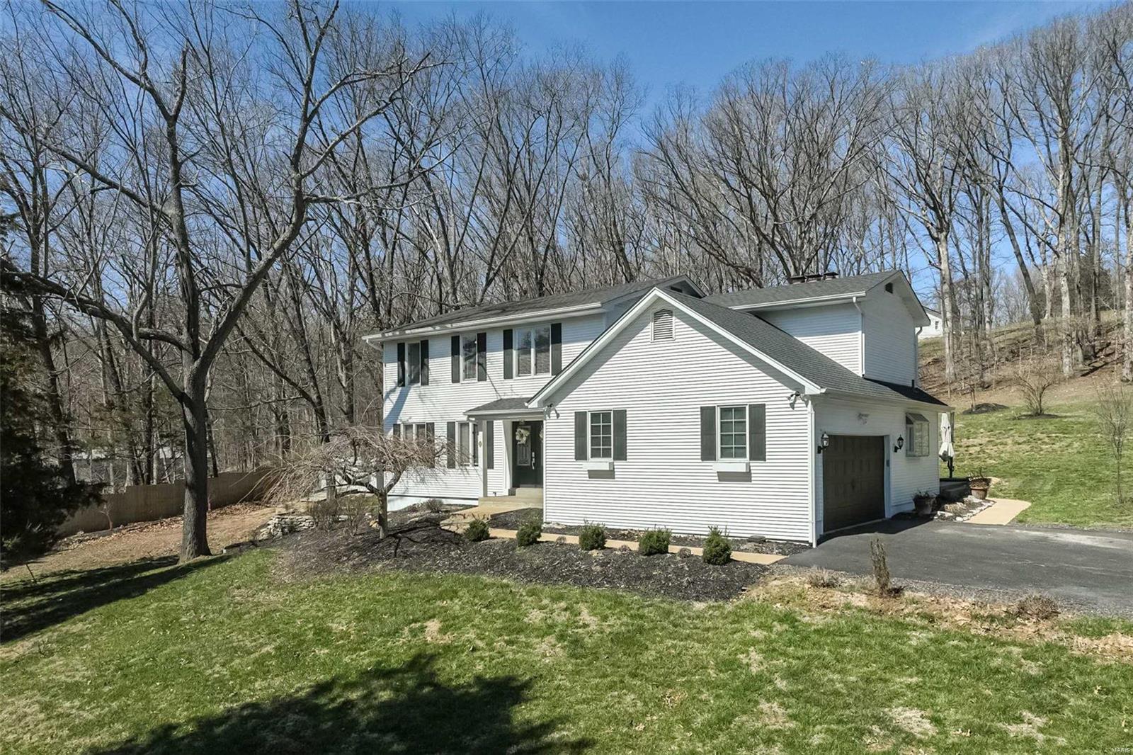 This four-bedroom, two-and-a-half-bathroom house sits on approximately 3.4 acres, offering a serene setting. The home features an open, spacious layout with abundant natural light throughout. The welcoming entryway leads to hardwood floors that extend into open living areas.
The kitchen is a standout, offering ample cabinetry and countertop space, as well as  upscale stainless steel appliances and gorgeous solid surface counters. The spacious dining area adjoins the kitchen for everyday living and entertaining. A fireplace adds warmth and ambiance to this versatile space.
The primary bedroom includesa fireplace, with a renovated en-suite bathroom you'll love. Three additional bedrooms provide flexible space. 
A huge covered deck is made for memory making gatherings! An outbuilding on the property could be suitable for a variety of uses, a workshop? a chicken coop? Horses allowed too! Newer systems!
Enjoy a rural lifestyle that includes great Rockwood schools, easy commute!