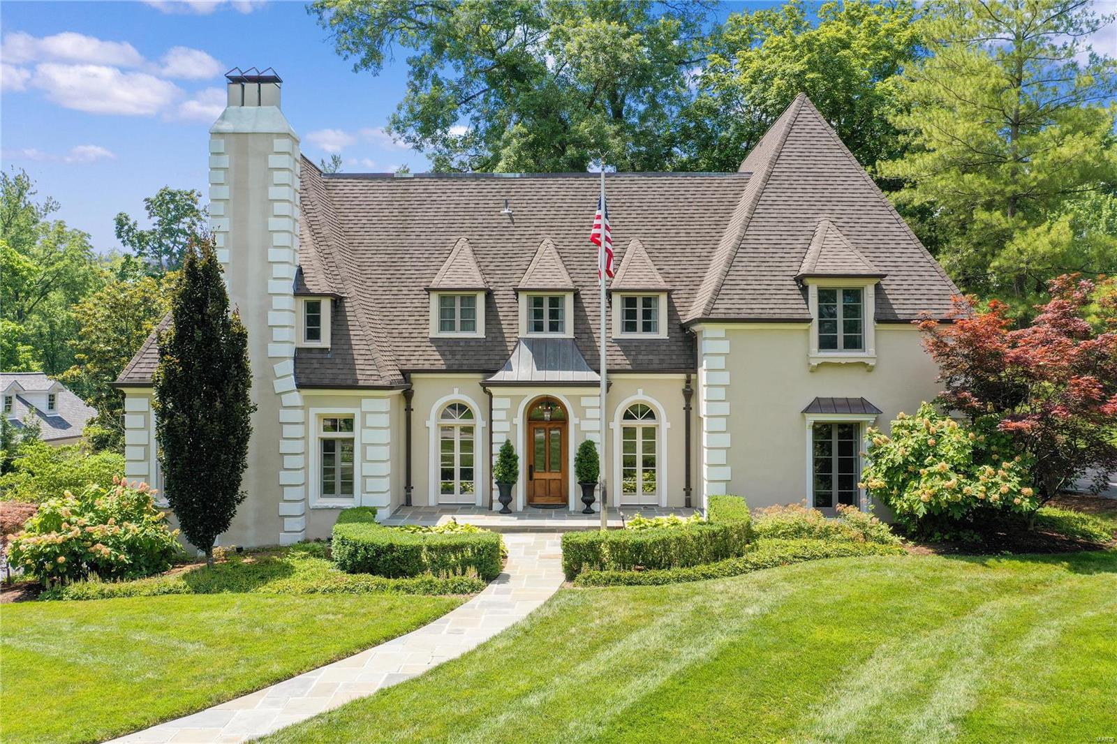 Gracious 2-story French home on Picardy Lane in the heart of Ladue. 4bed 4bath property offers the elegance of old world living alongside modern day amenities. Perched on 1 beautifully landscaped acre, home offers both a private, resort sized heated pool & park quality playset.  Cyprus beams adorn the ceilings of spacious formal entry, dining room, & kitchen. Recently renovated, the eat-in gourmet kitchen features SubZero & Viking appliances, oversized center island w marble countertop, & custom barn wood cabinetry.  A stunning curved staircase leads to 4bedrooms on upper level.  En-suite master boasts wood burning fireplace & 2 walk-in closets. Bathrooms clad in marble w Kohler & Waterworks fixtures & hardware. Addl features include whole house Generac generator, CAT 5 wiring, copper gutters, Weber Summit gas grill, & newer cedar fence. This is a rare opportunity in one of the most sought after communities in Ladue School District. Additional Rooms: Sun Room