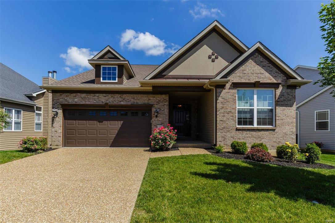 Beautiful 3 BD, 2 BA ranch in the highly desirable Tuscany neighborhood. This intimate setting of only 53, stunning homes sits in a premium location near the Page Ext (Hwy 364). The ext is elegant w/a brick façade, arch shingles, prof landscaping & exp aggregate drive-sidewalk. Features inc hand scraped hardwood floors, 9’ ceilings, granite countertops, island w/brkfst bar, Maple cabinets w/crown, dbl oven, st steel appl, custom W/I pantry, gas cooktop, roll out shelving, frml DR, open floor plan, Lux Mstr Bath w/sep tub-shower, dbl bowl raised height vanities, custom shelving in the Mstr W/I closet, ceramic tile floors in the baths & Lndry Rm, 2 car extra deep garage w/opener, Jeld Wen Low E windows, ecobee smart thermostat-humidifier System, a 16x8 covered composite deck & more. The LL has a tall pour & bath R/I. Enjoy easy access to the Katy Trail, historic Main St, Creve Coeur Park, Restaurants, Recreation, Lambert Int airport & the Streets of St Charles Entertainment district.