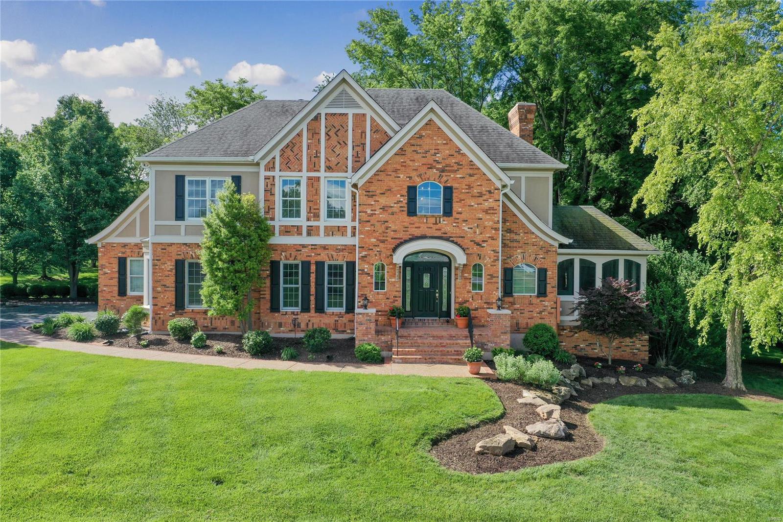 Welcome to this custom built, one of a kind elevation in Whitmoor Country Club! A spacious entry w/2 story inverted vault ceiling & t-staircase opens to a great rm w/ a stone, wood burning fireplace, kit & breakfast rm in a 5 wdw bay. Enjoy the view of outdoors thru the many wdws & transoms in this area. The kit has SS appliances, a breakfast bar, dbl ovens, tile backsplash, 42"maple cabinets, pantry, & butler pantry leading to a din rm. The den w/wood ceiling & built-in bookcase can be private w/atrium drs at din rm & pocket drs at foyer. The master en suite offers a coffered ceiling, sitting rm in a 5 wdw bay, bath w/separate tub-shower, dual vanities & walk-in closet. Two bedrms join a J&J bath & bedrm 4 has a private bath. Completing approx 4000sf of living space, the LL has a rec rm, office, full bath, 2nd laundry rm, & access to the gar thru another staircase. Retreat in the cozy screened in porch or private patio. Updates include paint, carpet, appliances & dual furnaces.