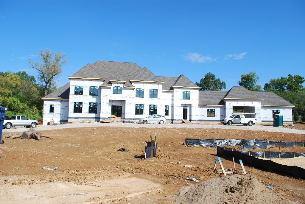 To be built: 7400 sf. ft, 1.5 story home on 2.5 acres in Mason Heights. Mason Heights is an enclave of 4 homes on 11 acres in Town and Country. The estimated completion date of this home is early Summer 2016. The exterior will be all brick and stone with cut stone windows and door surrounds at the front. The four car garages will have a drive through porte-cochere. Large multipurpose craft/mudroom area accessible from the front and garage.  Four full suites and an upstairs family room on the second floor. This home features both a main and second floor laundry and boasts a main floor master bedroom suite. This home has two fireplaces; one in the great room and one in the hearth room. This custom built spec home is located in a cul-de-sac, adjacent to a park. This home also features a central vacuum, alarm system, 2-stoty entry foyer and many more amenities too numerous to list.

Until home construction begins, the 2.5 acre lot is available for purchase for $668,500 Some Accessible Features Additional Rooms: Mud Room COOL: 14 SEER+