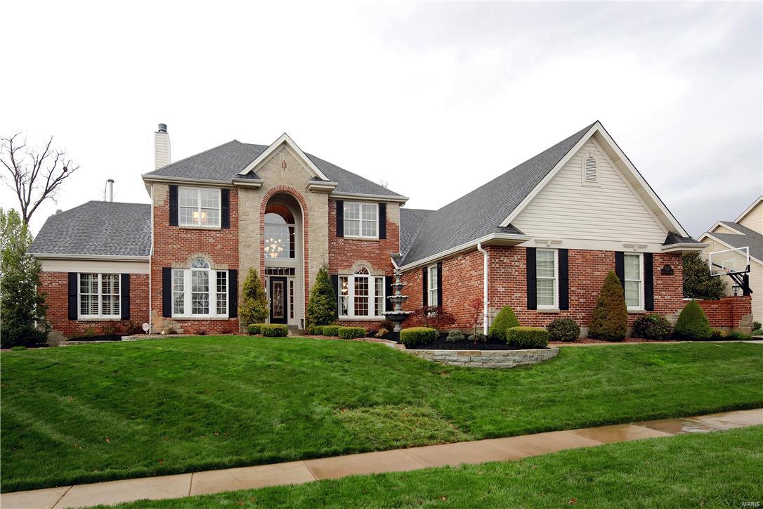 With absolutely the most beautiful view you will see,this exceptional home has a 2 story great rm,beautiful woodwork & hardwood flrs & many updates.Originally built with 120 upgrades,this discriminating owner has made continual improvements which include replacement of all windows to Pella windows which on the rear of home include many w/cellular shades-shades inside the glass.The extra large 1st flt master bedrm has fireplace & totally updated bath!A formal dining rm,large kitchen/sunroom/breakfast rm,&beautifully paneled office w/fireplace complete the 1st flr.Upstairs there are 3 additional bedrms each w/hardwood flrs & each w/full bath.The walkout LL of this gorgeous home is the icing on the cake--lovely bar area,private theatre room,two large sitting areas,exercise rm,& really beautiful full bath.Step out to what really sets this house apart-the gorgeous backyard w/it's spectacular view.You will love the stone fireplace/patio area.Don't miss the dry below deck.Newer roof,3 car gar