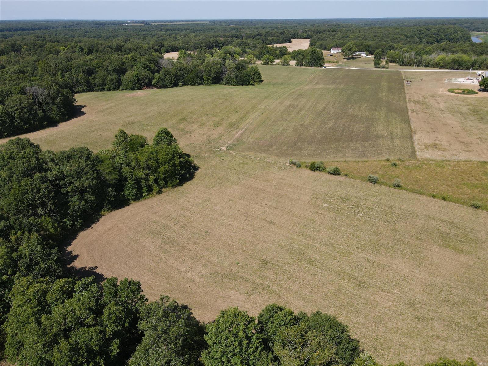 FOR SALE 29+/- acres Mark Twain Lake Country in Monroe County, Northeast Missouri. 2/3 open, 1/3 in woods and perfect land for hunting, horses, cattle, CRP, tenant farming or goats, you pick!. Backs total to woods on two side. Perfect pockets for your deer stands! Whitetail deer & turkey are waiting for you!  Roadway frontage, rural water, nice spots to build on.  The area is just off Crutcher Branch of Mark Twain Lake, minutes from HWY 24S to nearest boat ramp.  What a great place to call your lake getaway! Dream it! See it! Own it!

20 Acres tillable is currently leased until December 2023 at $120 per acre. 

Adjoining land available MLS 23043085 111 +/- acres with cabin.