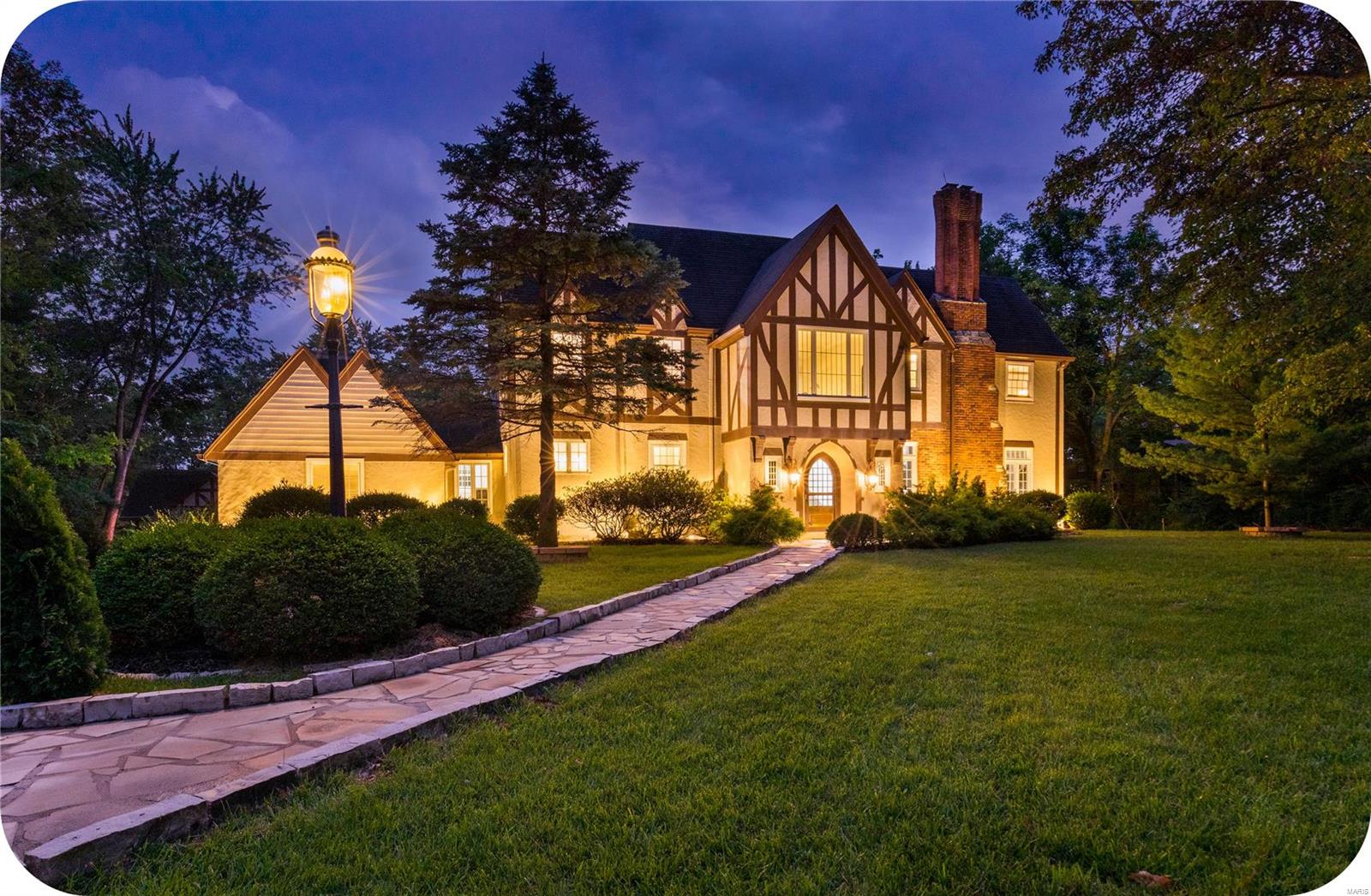 Live the life of luxury in this beautiful Tudor located in Westwood Country Club. Inside the 2-story foyer you'll notice stunning Terrazzo floors & original architecture throughout. There's plenty of space for entertaining in the large living room, formal dining room  + huge den equipped w/ wet bar & wood burning fireplace. Beautiful updated kitchen is truly a chef's dream featuring custom cabinetry, quartz countertops & high end appliances + plenty of space for entertaining. There's a main level in-law suite w/ private bath & double closets + main floor laundry too! You'll notice the cast iron stair spindles as you head up to the second level which is filled w/ a spacious primary suite (w/ beautifully updated spa-like bath), 2 additional large bedrooms & another updated full bath. The 3rd floor features an additional large room, perfect for another bedroom or living space & a private bath. All of this located on over an acre lot w/ a private pool & huge patio!