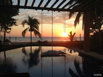 Imagine yourself enjoying the sun setting w/a glass of wine in your private infinity pool overlooking the sweeping views of the beach & the Pacific Ocean! This one of a kind beach front home boasts 3 spacious bedrooms, loft sleeping area, 4 baths & sleeps 14 comfortably. Each bedroom has large private baths, walk-in closets & private terraces. Master bedroom has private bath & balcony overlooking the beach. Large modern kitchen, Dining room table accommodates 14. Great outdoor entertaining area & lush gardens. Infinity pool w/built-in bar stools to enjoy the sunset. 40 meters of sandy beach frontage, 1/2 acre double lot. Separate caretakers quarters w/kitchen, bedroom/bathroom. 3 car garage w/dehumidifier.Could be private home, B&B, corporate retreat. Troncones is just minutes from Ixtapa/Zihuateneo & major airport. Troncones boasts an avg. of 300 days of sunshine a year, make your appt today to view this home. Sold turn-key w/all furnishings, only a few personal effects will be taken.