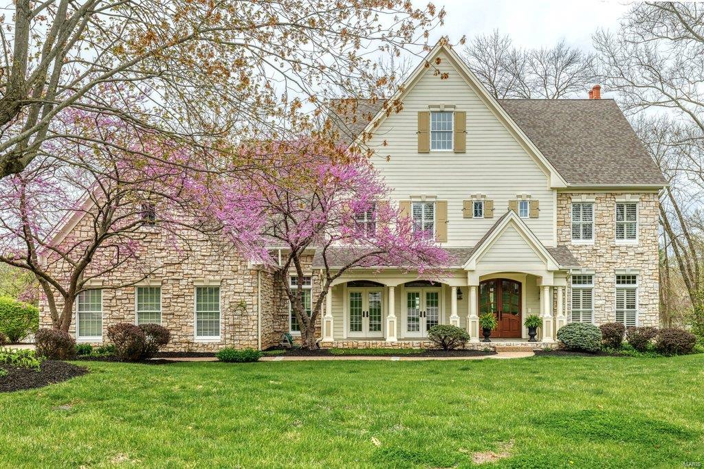 Beautifully designed 2-sty Estate home from award-winning Premier Homes. Over 7000 sf of living space enhanced by the finest in craftsmanship & meticulous attention to detail. Impressive hardwood foyer leads to private study, elegant dining room with 2 sets of French doors & spectacular great room with marble fireplace & wet bar. Designer kitchen with granite countertops, 42” cherry cabinetry, premium appliances & butler’s pantry adjoins breakfast room with wide bay window & atrium door to deck & hearth room highlighted by floor-to-ceiling stone fireplace. Broad oak staircase with palladian window & display cases accesses master bedroom suite with luxury bath with jetted tub & 3 additional bedrooms, 1 with ensuite bath & 2 with Jack n’ Jill bath. Walk-out Lower Level includes recreation room with direct vent fireplace, game room, 2nd kitchen, workout room, 5th bedroom & full bath. Situated on a 1+ ac cul-de-sac lot with deck & resort style pool & patio surrounded by landscaped gardens.