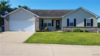 This exceptionally well kept home is just 12 years old.  This home has all the welcoming features that you are looking for from the big front porch, landscaped front yard and freshly painted shutters. Each room is very nicely proportioned, from the large eat-in kitchen and open airy Great room with vaulted ceilings to the welcoming master bedroom suite. The garage has a large area in back for a shop or storage and enters into a main floor laundry/mud room. The kitchen has oak cabinets, and walks out to a back deck and patio for all your get-togethers. The walk out lower level is finished with two separate living areas and still lots of storage. There's also a rough-in for a future bathroom. Call today to schedule an appointment.