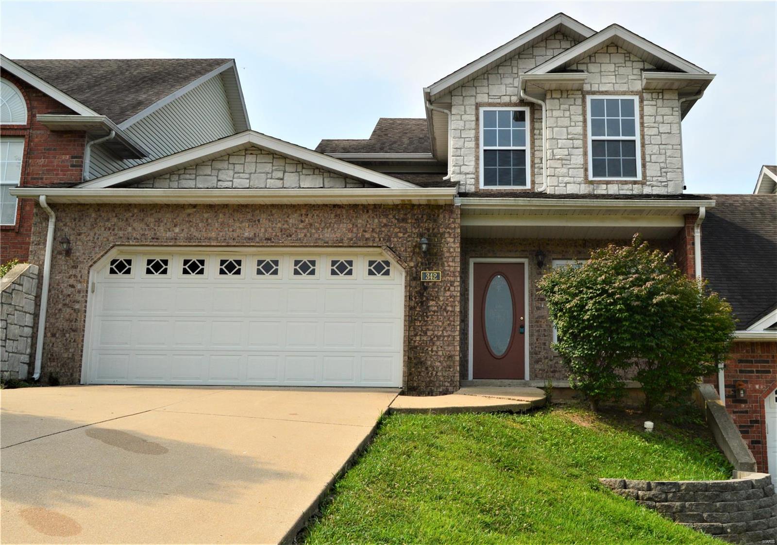 This beautiful three bedroom, two and a half bathroom condo has BRAND NEW laminate, carpet and paint! Less than five miles from the main gate of Fort Leonard Wood and is centrally located minutes from dinning, shopping and all the amenities St. Robert has to offer! Enjoy the convince of city living with a peaceful view of Missouri's natural beauty, as this home over looks a stunning wooded valley. Once inside, you are greeted by beautiful laminate flooring, gas fireplace in the living room, ceramic tile kitchen, breakfast bar, and spacious dinning area. The massive Owner's Suite also has laminate flooring, trey ceiling, walk-in closet and an ensuite private bathroom. Upstairs are two additional bedrooms each boasting oversized walk-in closets, laundry room and shared full bathroom in the hallway. Step out onto the back deck with a picturesque tree line, great for entertaining or relaxation. Carmel Valley Condo Association fee is $100/month and includes lawn care! Location: City