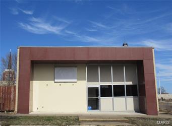 Commercial building built in 1958 with 2779 sq feet. One story with large reception area, several private offices and conference room. 2 baths and kitchenette area, full unfinished basement. Large parking lot in the back. Building needs work and being sold "AS IS" No seller's disclosure provided. Location: Downtown