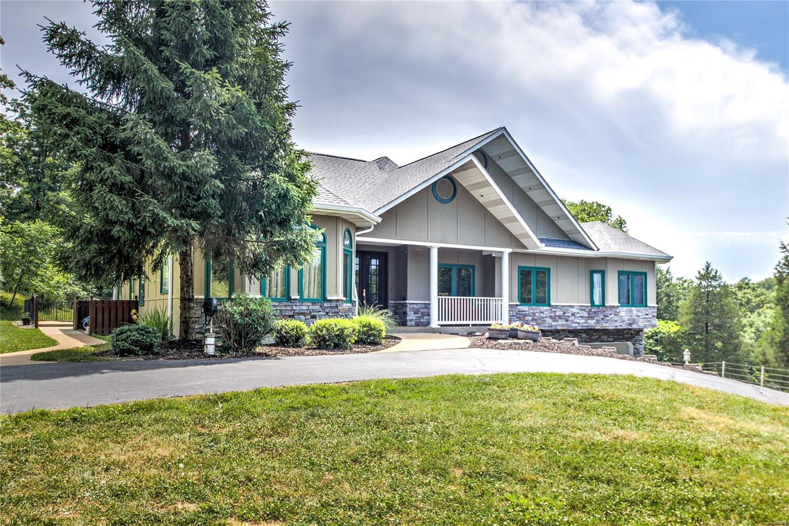 Sprawling 4 bedroom ranch home is a private retreat from the modern world with nearly 5000 sq ft on over 14 park-like acres w/4 stall horse barn & tack room. Private cul-de-sac location in 4 lot community. Main floor features 9' ceilings, gleaming wood flooring thruout main living areas. Chef’s kitchen boasts granite counters, SS appliances, custom cabinetry, downdraft gas cooktop, double ovens & walk-in pantry. FR features Buck stove/wood-burning FP & and opens to spacious covered patio overlooking pastures & barn. Plus, in-ground Baker Pebbletech pool w/lap lane & fountain. Entertain in your formal LR & DR. Private owner's suite boasts luxury bath & huge w/in closet. Finished LL features additional space with 9' ceilings, GR w/gas FP, bonus rm, 4th bedroom & add'l sleeping area & bath, plus storage. Newer roof & Geo-thermal HVAC, 2 water wells/water softener, 3 car o/s garage, central vac & more! All of this-plus top-rated Rockwood schools & nearby parks make this the perfect choice!