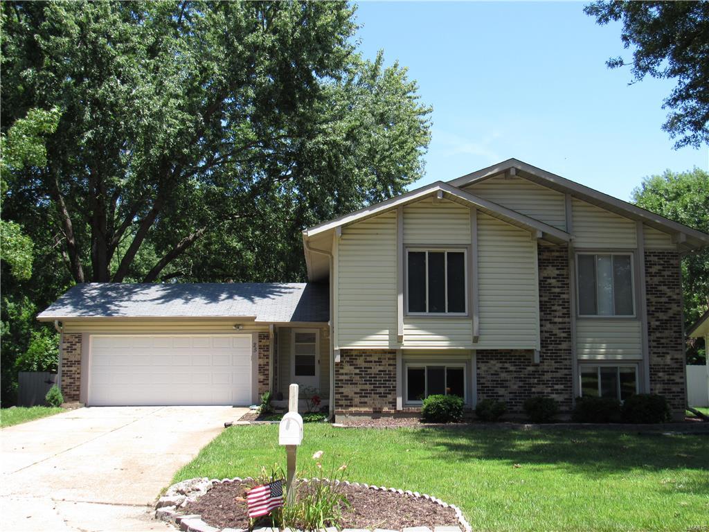 Nice 4 bdrm 2 full ba Multi level home w/over 2100 sq ft of living space. Enter spacious foyer & notice the open floor plan. Upstairs you'll find a Living Rm, separate Dining Rm & updated kitchen w/smooth top range, dishwasher, built in microwave, breakfast bar, tile flooring & backsplash. Walkout onto a freshly stained (23x12) deck overlooking a private yard. Downstairs is a finished W/O LL-Family Rm w/ woodburning fireplace, Dining Area, full bath & spacious 4th Bdrm that could be used as a Media Rm, Office or endless possibilities. Walkout to a (29x13) patio. Other features include newer roof (July 2016), vinyl siding, 2 car garage, fenced backyard, St Peters Rec Plex amenities, walking distance to Dardenne Park & St Peters Golf Club & Pool. 13 Month Home Warranty for the new homeowners. Great Location!