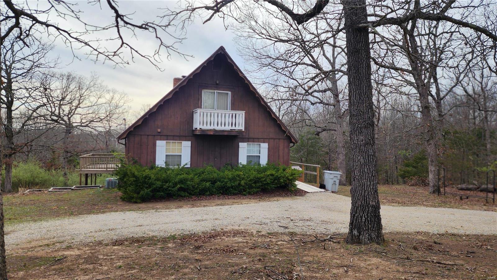 NEW PRICE on This Charming 1 1/5 Story A Frame Cabin, 2 possible 3 Bedrooms 2 Bathrooms located in the Private Lake Community of Terre Du Lac.  Terre Du Lac boast 16 Lake, 4 Ski Lakes, 2 Beaches, 2 Golf Courses, Parks, and so much more. Home is still going to have a sale for contents and home needs some tlc. Motivated Seller