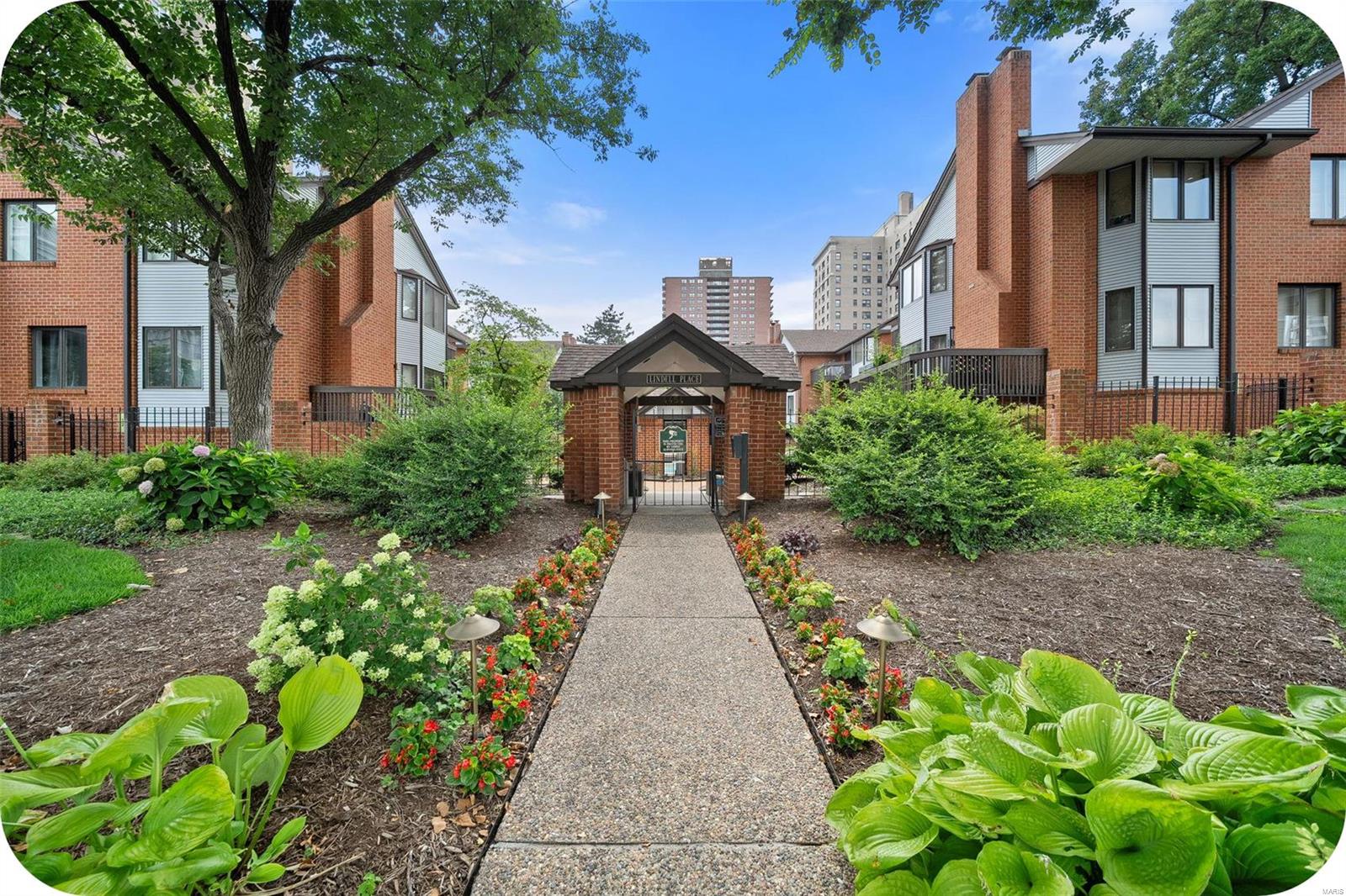Stylish 2-Bed, 2-Bath CWE Condo offers the perfect blend of modern living & classic charm. As you enter the complex, you're greeted by lush gardens, a pool & beautifully landscaped walkways leading to your home. Inside, open-concept living spaces & two private balconies create a perfect setting for both relaxation & entertainment. The kitchen, w its cool retro flair, has a bar opening to the dining area. The living room, features a cozy wood-burning fireplace & extends to the front deck—ideal for morning coffee or evening cocktails w a view of the pool. The spacious primary bedroom is a true retreat, complete w its own deck & an updated bathroom featuring a large vanity & tub/shower combo. Plus, a guest room w a hall bath. Enjoy the convenience of in-unit laundry, a two-car garage & extra storage. New HVAC (2024).  Just two blocks from Euclid, Lindell Place puts you at the epicenter of shops, restaurants & the best of city living. Schedule your showing today! Location: City