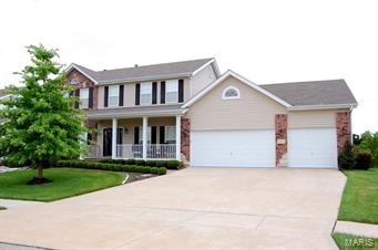 Updates & Upgrades.Over 3400sq ft of living space.4 beds,3.5 baths & a HUGE OS 3 Car Garage.Excellent curb appeal w/ large front porch, encld, soffits & fascia, leaded glass frt door & side-lights,prof. Landscaping & Irrigation syst. on cul-de-sac.Tree-line backyard, large deck w/steps & patio.Main Floor features hardwood floors, 9'ceilings, DR w/Tray Ceiling & Wainscoting,Fam Room w/5 bay window-gas f/p w/brick hearth.Kitchen/Brfst Room features Butterfly Island/Brfst Bar,42" Maple Cabinets,planning desk, & pantry.M/F Laundry.Master Suite boasts Vaulted Ceiling,2 W/I closets,double vaniites,sep tub/shower & water closet.Additional Bedrooms are spacious w/plenty of closet space.Newly completed LL Features Wet Bar w/Custom 42" Cabinets,Stainless Backsplash,Plank Laminate Floors,Game Room area w/WO to Lower Level Patio, Gym area wi/Private Bath that features ceramic surround shower & floors, and an additional room currently used as Theatre Room..Lots of Space and Fun Await the new Buyer.
