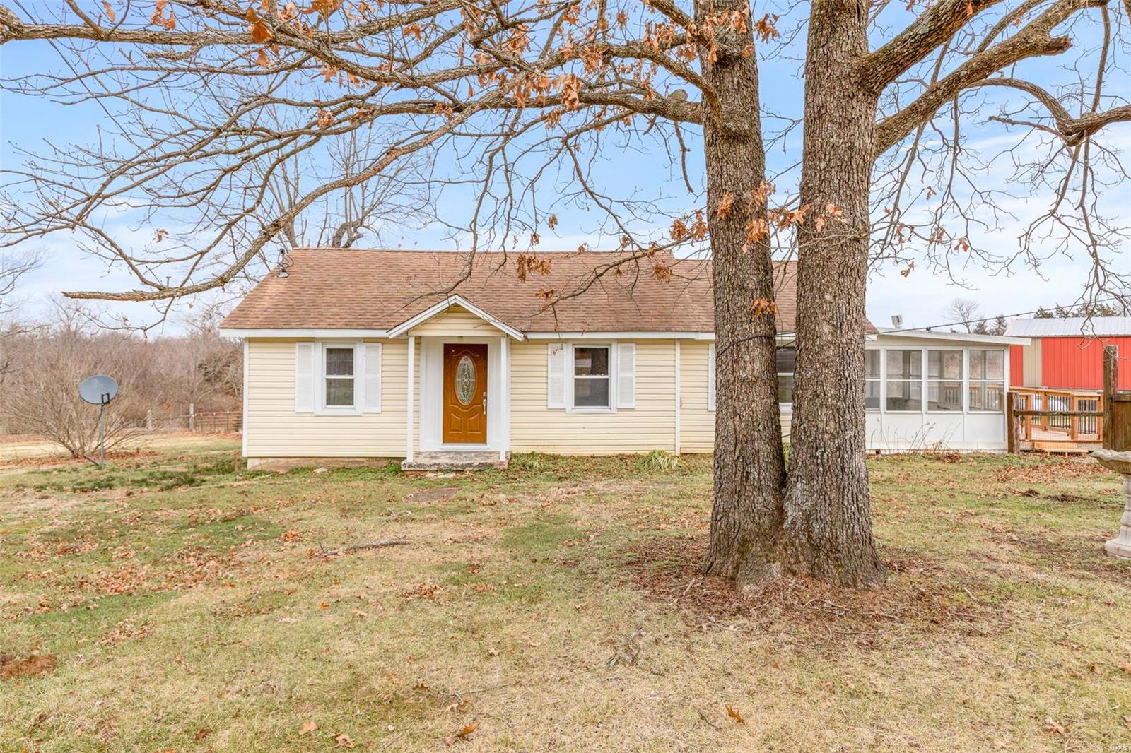 Welcome Home! This home offers 2 beds possibly 3 with 1.5 baths on 5 acres just right outside of town! Mostly updated with vaulted ceilings in the master, main floor laundry, sunroom, and deck! The 30X40 pole barn offers plenty of storage for parking and a barn is located on the property as well! Seller does have horses but will be in fence.