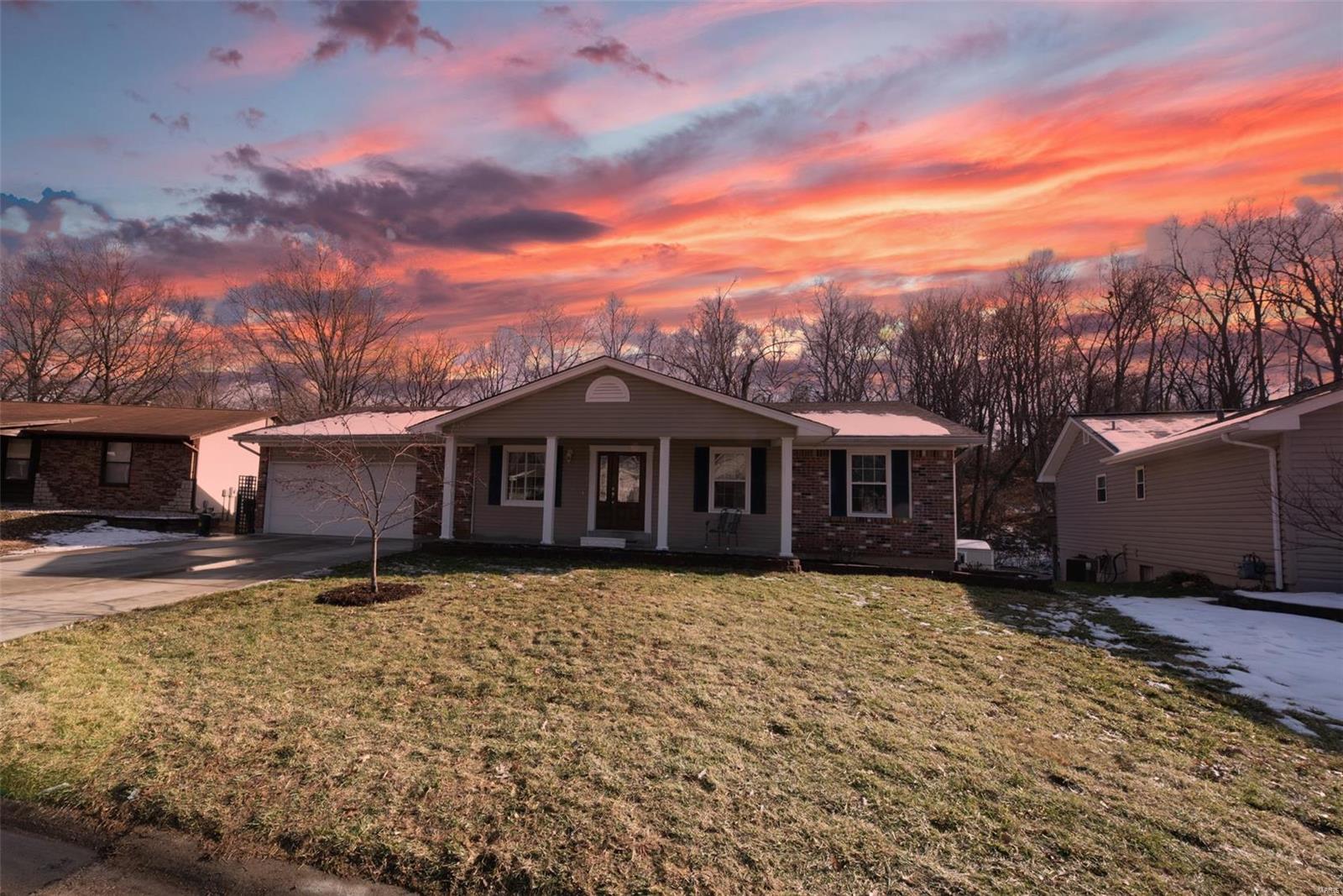 Meticulous ranch in Francis Howell Schools offering just under 2,400 of finished square feet. This home has it all w/ updates & features including: New roof (2019), updated kitchen & baths, fresh paint, WB fireplace, finished walkout LL with new drain tile system, large fenced-in yard, & a 2 car garage.  The eat-in kitchen is updated with SS appliances, custom tile backsplash, newer countertops and walks out to the deck perfect for grilling and entertaining. Steps from the kitchen is an additional family room bringing all the homey feels with a woodburning fireplace and tons of natural light.  The finished lower level is open & includes a large rec/family space, additional multipurpose room, and plenty of storage (Pool table & accessories included). The level backyard is an ideal space for kids/pets including a spacious patio, swing set, and backs to trees and common ground. Don’t let this opportunity slip away! Call today for your private showing!