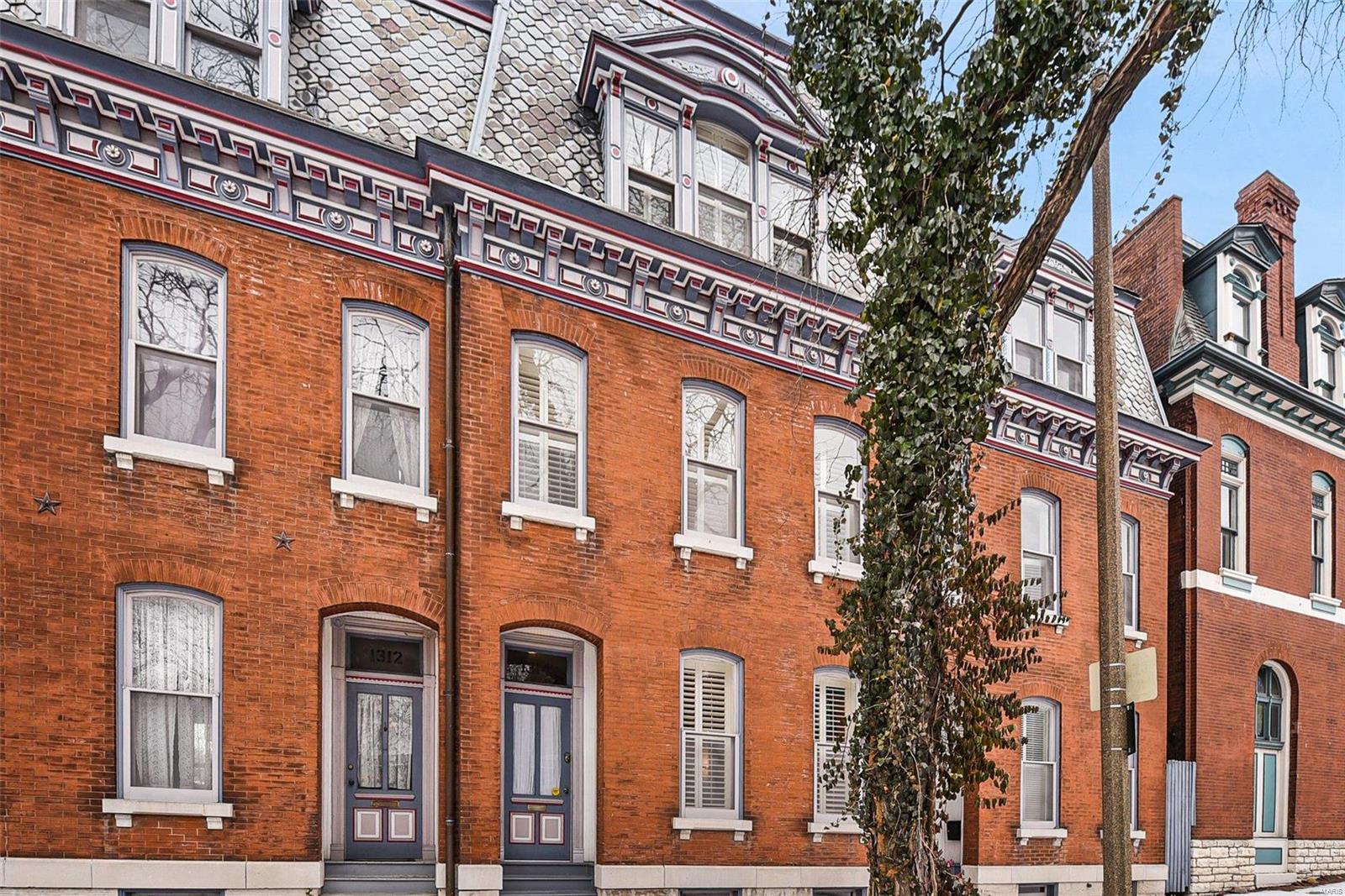 Take a step back in time into this rowhouse located in the Lafayette Square historical district.  Lovingly maintained and brought into the 21st century to meet current lifestyles while maintaining historic charm with 10' ceilings, tall windows that let in natural light, hardwood floors and 2 wood burning fireplaces .  Push aside the pocket doors from the living room into the separate dining room to host gatherings of family and friends.  For those who love to cook the kitchen is outfitted with a gas range, plenty of countertop space and room to create your culinary masterpieces. The 2nd floor has 2 bedrooms and a full bath.  The true sanctuary is the 3rd floor Primary Bedroom Suite complete with a full bath, walk-in closet, wood burning stove and reading space with built-in bookcases.  In the summer, you will feel like you're in your own personal treehouse. Just steps away from Lafayette Park and many wonderful restaurants and shops.  Welcome Home!
