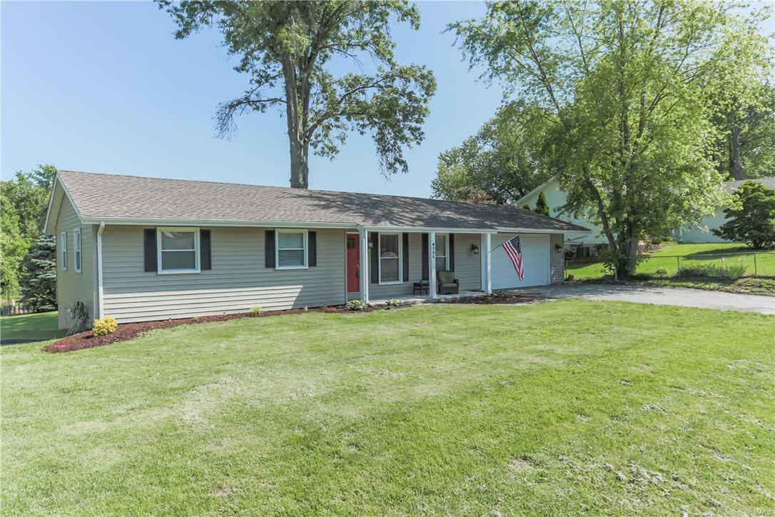 FIRST SHOWING OPEN HOUSE SUNDAY 5/22 1-3.  All you will need to do is move in!  Beautifully renovated, well maintained home, centrally located.  3 bedroom 2 bath home.  Home includes oversized (extra wide, extra deep) 2 car garage, extra large drive way big enough to turn around or even to park up to 6 cars.  Home has a walkout basement & amazing extra large deck. 2013/14 updates include the Newer Windows, Gorgeous Kitchen and Tile Backsplash, New Maple Cabinetry and 3/8" Engineered Hardwood throughout the Home, Ceramic Tile Flooring in Both Bathrooms. white six panel doors and updated bathrooms.  Move In Ready.  Partially Finished Basement with New Carpet and Millwork, Updated Electric & Huge Covered Deck overlooks neighboring Pond that backs to trees in this level Backyard (pond i on neighbor property). Newer Vinyl Siding and Newer Architectural Roof.