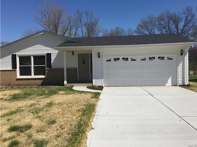 Newly updated Ranch home on level lot which backs to trees with a private 13 x 19 covered patio. The main level has a very open flowing floor plan with an eat-in kitchen, new stainless appliances, newer freshly painted cabinets and a ceramic tile backslash with under cabinet dimmable lighting. This home also features new ceramic flooring in kitchen and both bathrooms, six panel interior doors, new carpet throughout main level, and newer double hung vinyl replacement windows. Both bathrooms have new comfort height vanities with a new ceramic shower in the full bath. New HVAC, hot water heater, architectural roof, and concrete driveway. Basement is partially finished with an oversized laundry sink and a 1/2 bath, ready for your finishing touches.  Prime location, close to Hwy K, I-70 and Page Extension with easy access to shopping and entertainment.
