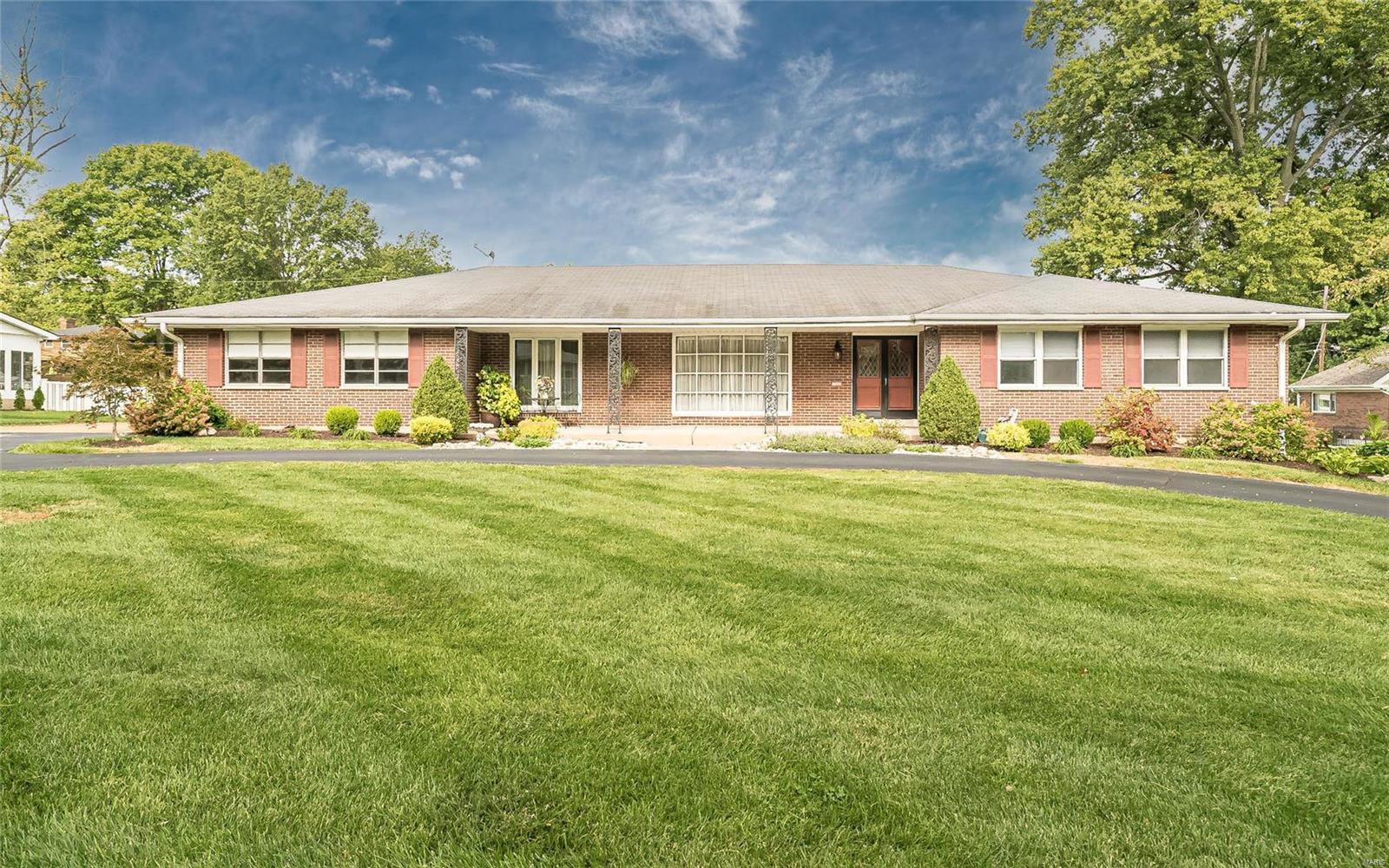 This sprawling, 2500+sf South County ranch is ready for IMMEDIATE POSSESSION; total living area is over 3,300sf!!  This home is 4 sides brick with a level fenced yard, and a huge kitchen with a six burner Bluestar* gas range! Plenty of room to spread out from top to bottom with a lower level recreation room and walkout basement! Main level family room has a wood burning fireplace with insert and blower, and steps out to a 30x28 paved patio. Featuring some updated bathrooms, gorgeous wood floors throughout living, dining, hall and bedrooms! Also features central vac system and an electronic air cleaner on the furnace! 
The main floor laundry is a combo laundry/mud/utility room, a perfect place to create a wall storage for backpacks, shoes, etc! 
Owner occupied for 25 years! County occupancy permit provided, come make this your next home! Built by "Gallagher", this home was built with piers around the entire perimeter to make for a solidly built house!! Additional Rooms: Mud Room