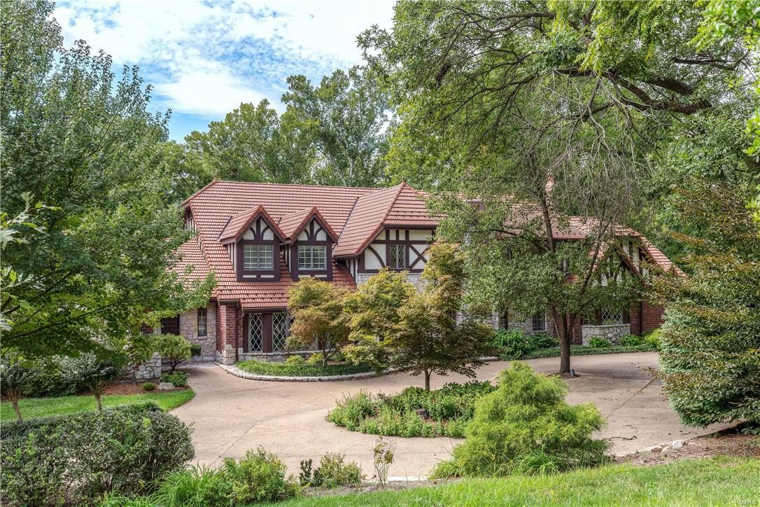 This stunning European-styled 1.5-Sty features over 7000 sqft of living space enhanced by rich hardwoods, elaborate millwork, soaring ceilings & custom built-ins. Grand 2-sty foyer opens to library-paneled study with antique Honduran mahogany fireplace, elegant dining room with built-in china cabinets & spectacular great room with floor-to-ceiling stone fireplace, mahogany wall unit & wet bar. Spacious open kitchen with custom cabinetry, premium appliances & planning center adjoins light-filled breakfast room, hearth room & sunroom with brick BBQ. Sumptuous master bedroom suite with marble fireplace & lavish His & Hers baths plus 2 additional bedrooms with Jack n’ Jill bath complete the main floor living quarters. Hardwood staircase accesses 4th bedroom, office/5th bedroom, bonus room & hall full bath. Incredible Lower Level includes recreation/workout room, steam sauna, full bath & racquetball court. Situated on park like 1.3 acre grounds with pool, hot tub, pool house & 4-car garage. Additional Rooms: Mud Room, Sun Room