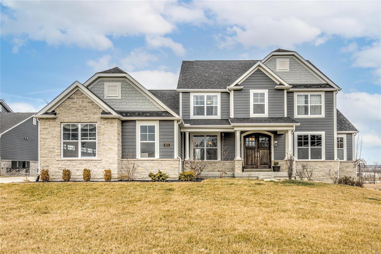 Custom Lombardo home. Premium bluff lot. Spectacular views. Stone elevation. Finished lower level w/ deep 9' pour, wet bar, & surround sound media room. Gourmet kitchen w/ stone arch, granite countertops, upgraded two tone soft-close cabinetry, center island that seats six, double convection oven, pot filler, & pantry w/ arched door. Luxury master suite w/ trey ceiling, bay window, sliding barn door, free-standing tub, & walk-in shower w/ trough drain. Stone-surround gas fireplace w/ cedar mantle. Mud room w/ custom cubbies, bench, & desk. Main level laundry w/ cabinetry & sink. Covered 12x23 deck w/ wood burning fireplace, recessed lighting, & fan. 9' ceilings. 2-story bay window. Arches. Attic fan. Loft. 2nd level laundry closet. Rounded corners. Engineered wood floors. Wrought iron railings. Upgraded lighting & plumbing fixtures. Double entry front door. Central vacuum. Adult height vanities. Dual climate controls. Wifi hotspots. Smart home system. Security system. Tall baseboards. Additional Rooms: Mud Room