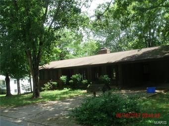 4 Bedroom, 3 Bath Home with a walkout basement in a well established neighborhood. Some updates include some new light fixtures , kitchen, Wood Laminate in the Living Room, Dining Room & Hallway & Ceramic tile in the Kitchen, Baths  & Utility Room & new tub/shower unit in Hall Bath, new doors from basement to outside, some new interior doors & blinds, and interior freshly painted.  Home also features a see thru wood burning fireplace between living room & dining room.    Utility Room offers lots of extra storage. Covered front porch, large deck and patio in the back and a large tree shaded back yard with chain link fencing.  Wak-out Basement offers lots of storage as well as an area for a workshop.