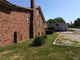 NICE CORNER LOT IN A HIGH TRAFFIC AREA!  TWO BUILDINGS ON THIS CORNER FOR SALE! Both buildings for $85,000.  LIVE IN THE BRICK HOME or RENT AND HAVE BUSINESS IN THE COMMERCIAL BUILDING.