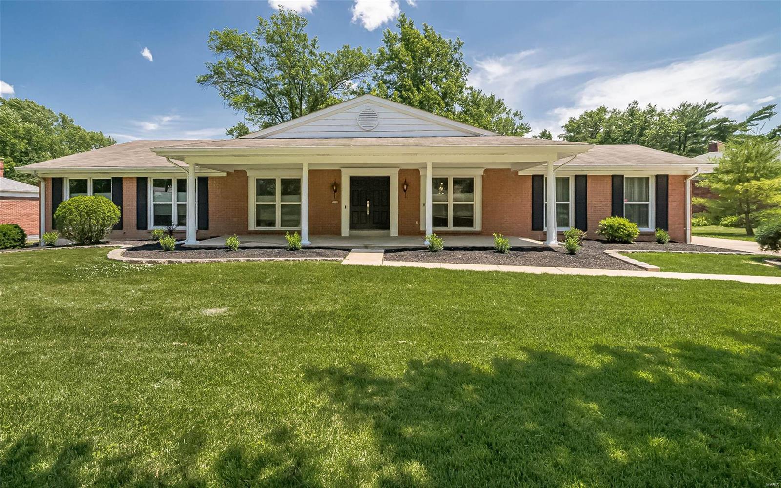 Beautifully updated full-brick ranch on park-like lot backing to the common ground in the prestigious Ladue Trails Subdivision! Home offers over 2900 sqft of living space on main level with 4 bedrooms and 3 updated bathrooms plus amazing ~1800sqft lower-level living space! You'll love the open floor plan and the light-filled spaces. Front sitting porch leads to the foyer and formal dining & living rooms. Huge great room with vaulted ceiling and fireplace opens to the updated kitchen with 42" cabinets, granite counters, double ovens, and coffee bar facing the expanse of the backyard & common ground. Gorgeous master suite with large walk-in closet, updated bath & shower, double vanities, and main floor laundry hookups. The lower-level offers additional living and entertainment space boasting a huge family room, full bath and 3 rooms that could be used as office or work out space with plenty of storage. Rear entry 2 car garage with oversized parking pad. Large patio with amazing views!