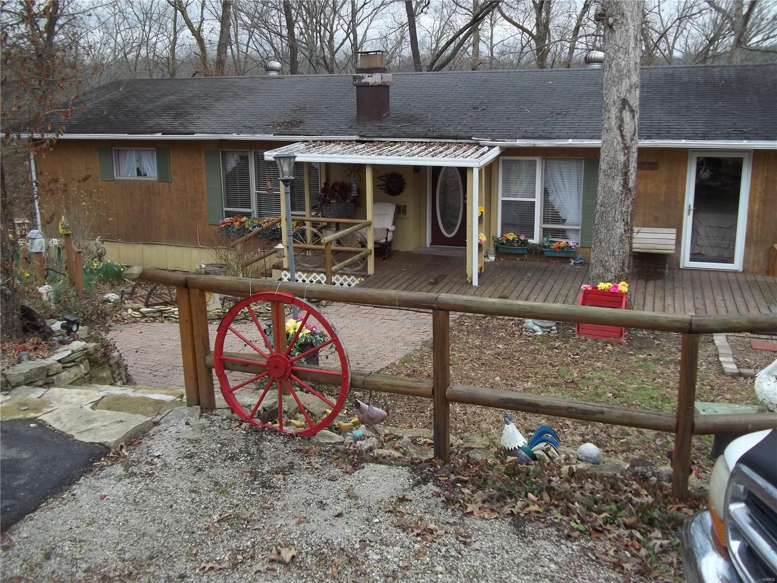 Very Nice, Well Kept Home. Lots of Hard work has gone into Landscaping. Covered front porch. Screened in back Deck. This property has 2 lots, a shed is on the empty lot. Backs to woods. Public water & sewer. Great Price, Great Location. Being Sold AS-IS.